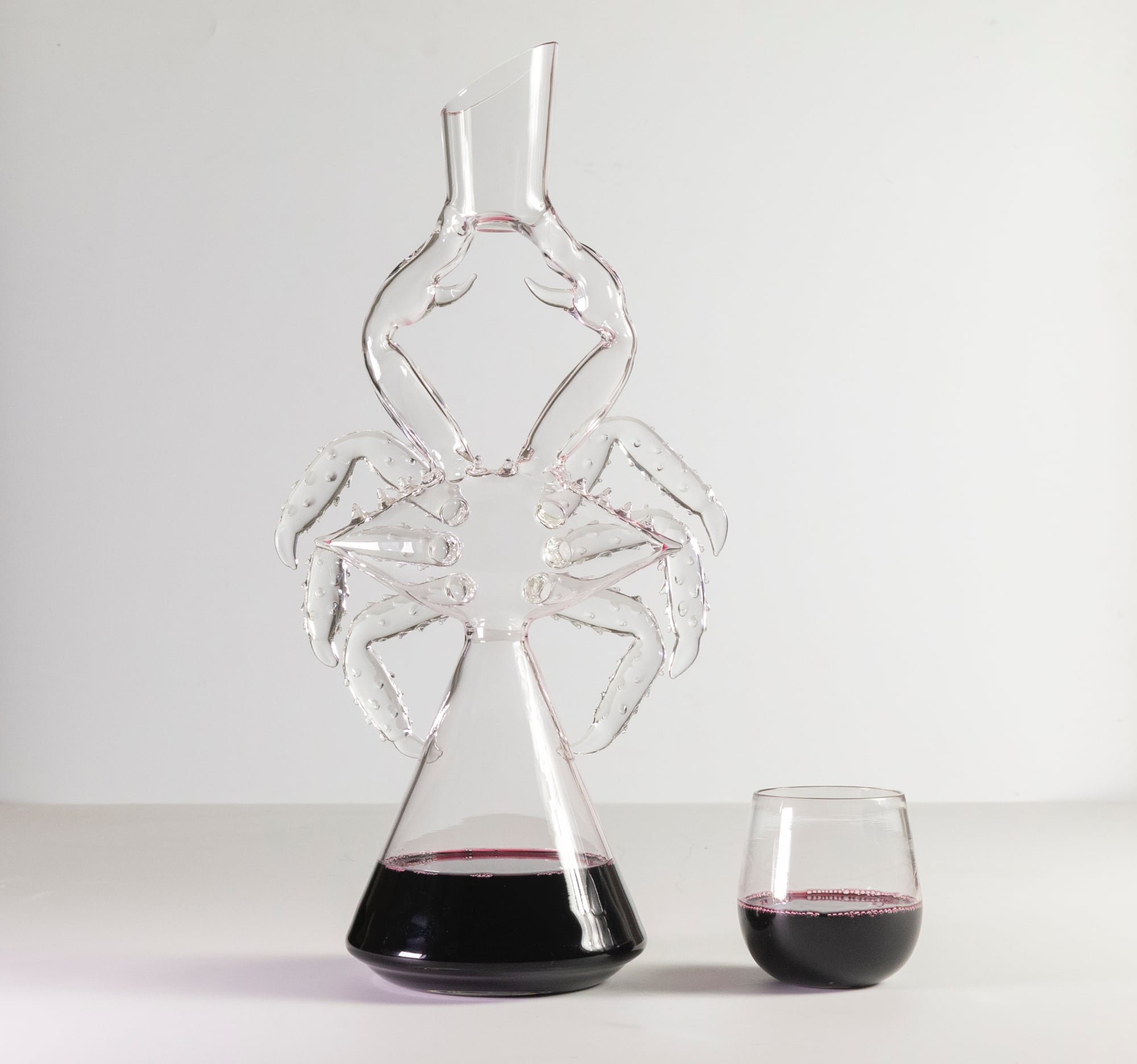Wine Streams Through Sea Creatures in Playful Glass Decanters by Charlie Matz
