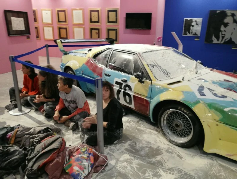 Climate Activists Throw Flour on Warhol-Painted BMW Art Car inMilan