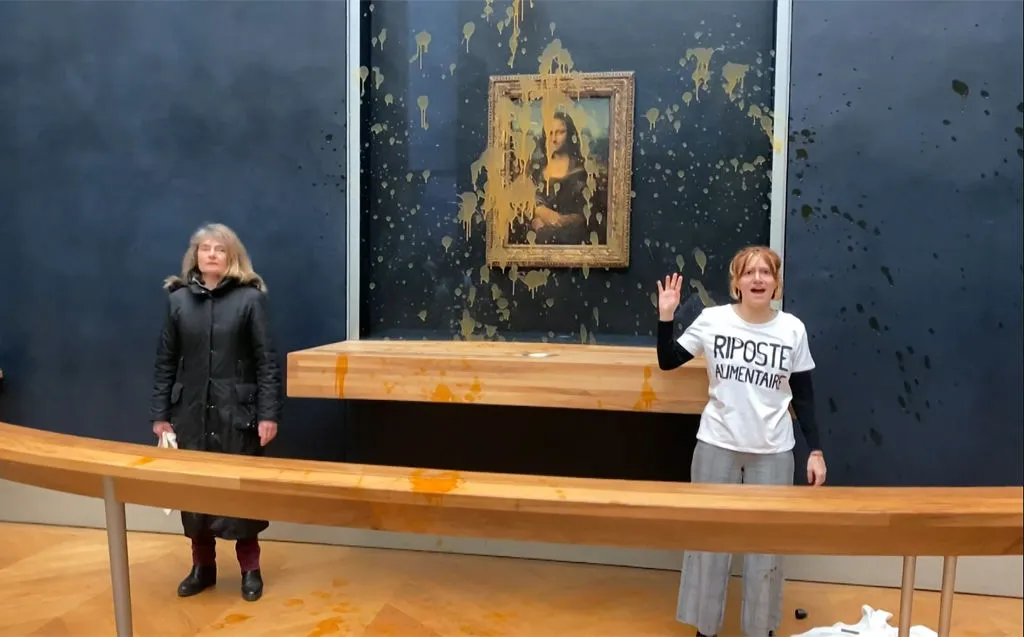 Mona Lisa Splashed with Soup by Climate Protesters