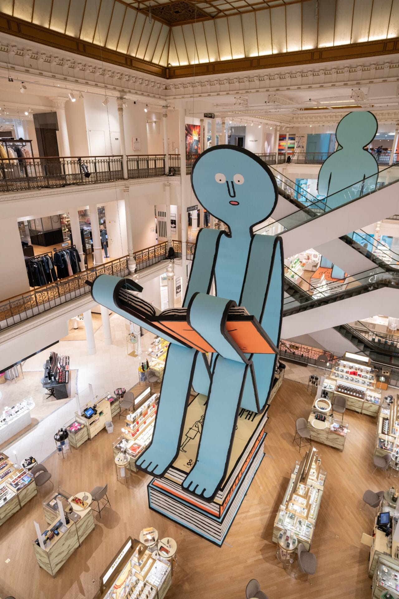 In Paris, Jean Jullien’s Two Cheery Bookworms Take Over a Shopping Center for ‘Mise En Page’